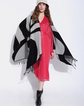 colourblock poncho with tassels