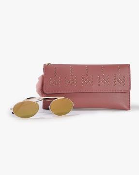 combo of embellished clutch with sunglasses