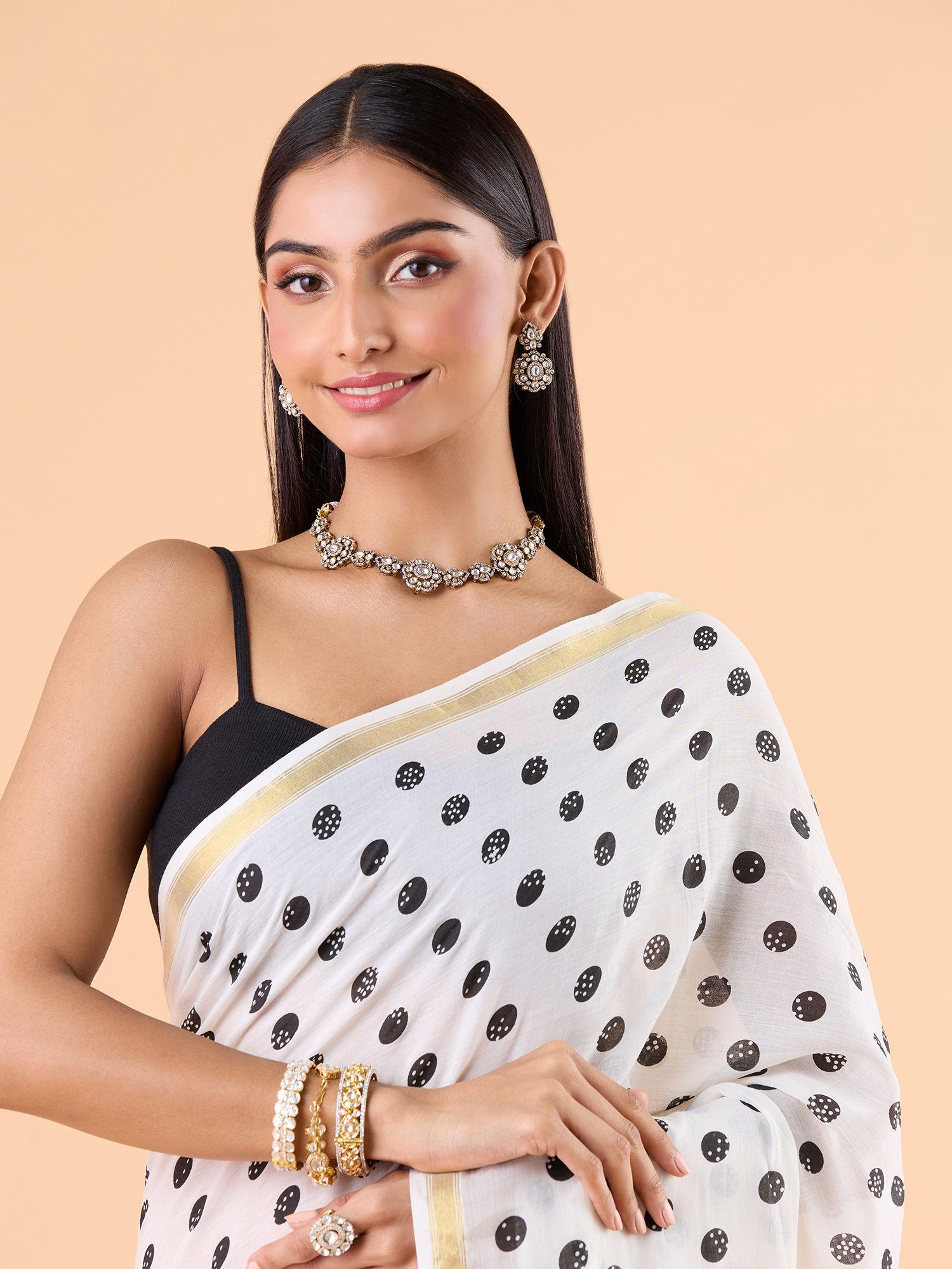 contemporary modal mul polka dots printed and zari border white saree and unstitched blouse