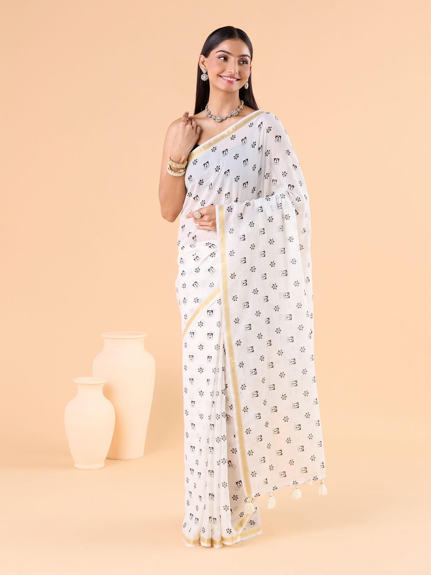 contemporary modal mul polka dots printed and zari border white saree and unstitched blouse