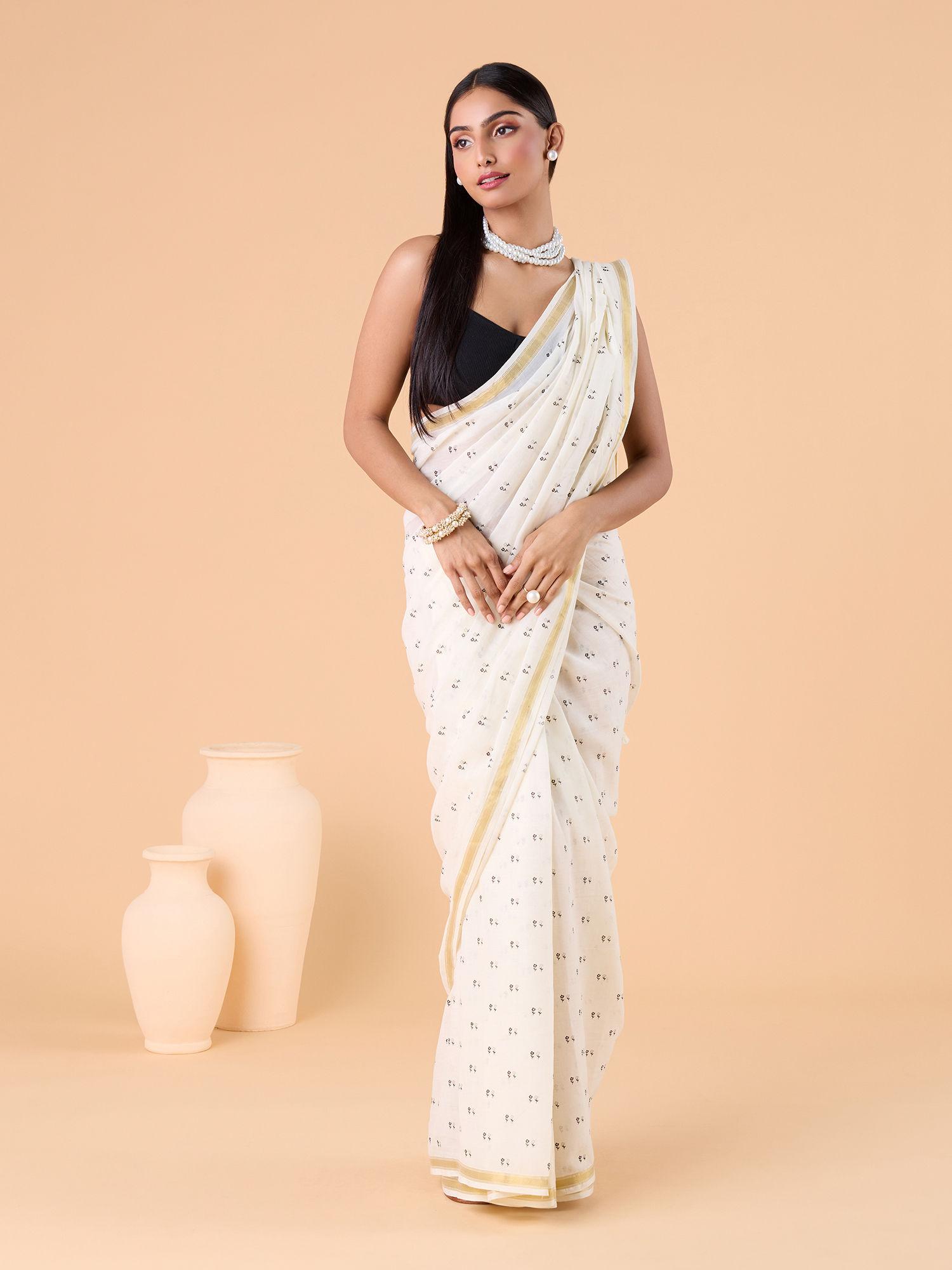 contemporary modal mul polka dots printed and zari border white saree and unstitched blouse