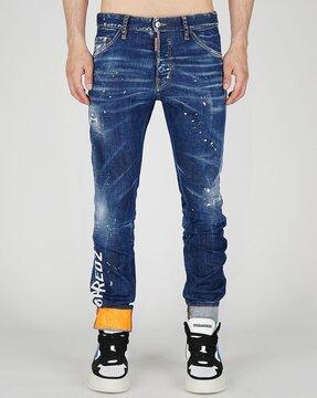 cool guy splatter print slim fit mid-wash jeans