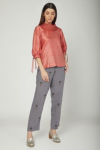 coral blouse with neck detailing