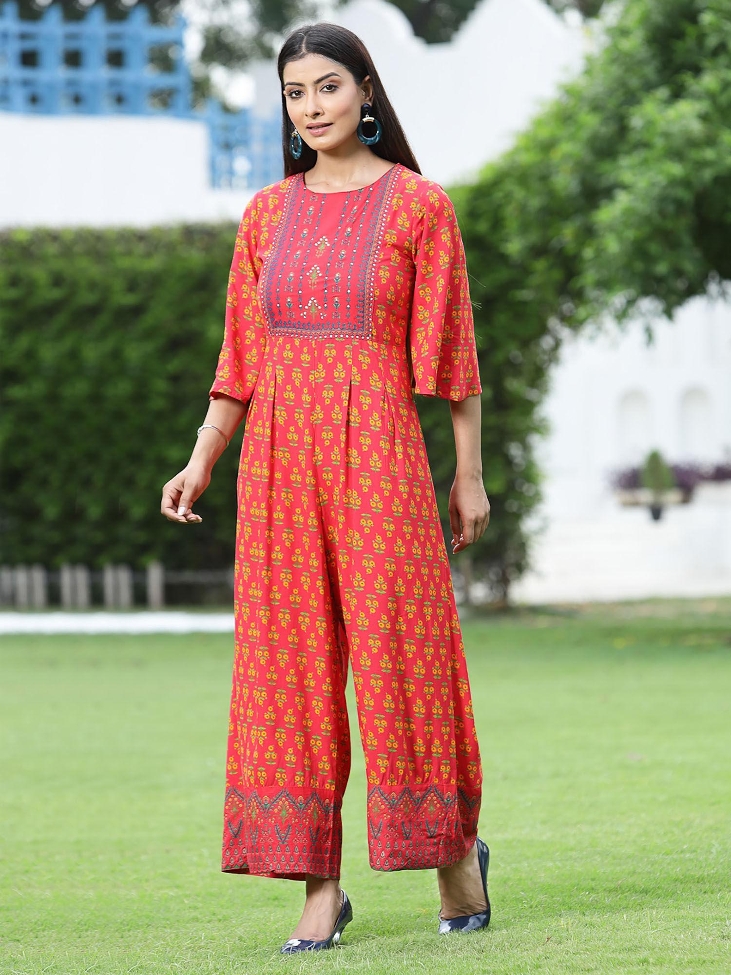 coral ethnic motif printed rayon flared jumpsuit.