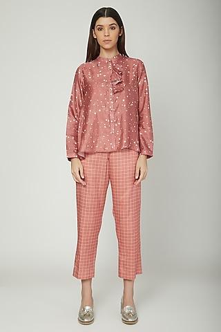 coral printed shirt with checkered trousers