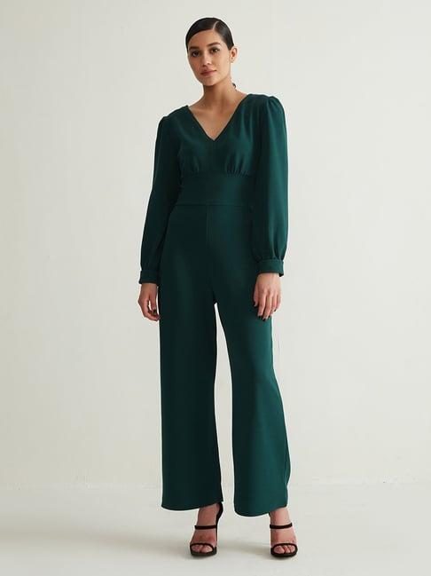cover story green jumpsuit