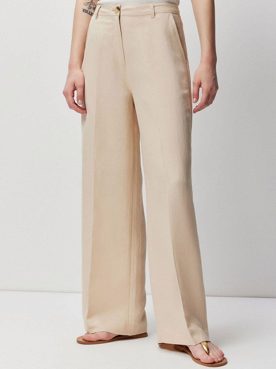 cover story women beige mid rise plain flared parallel trousers