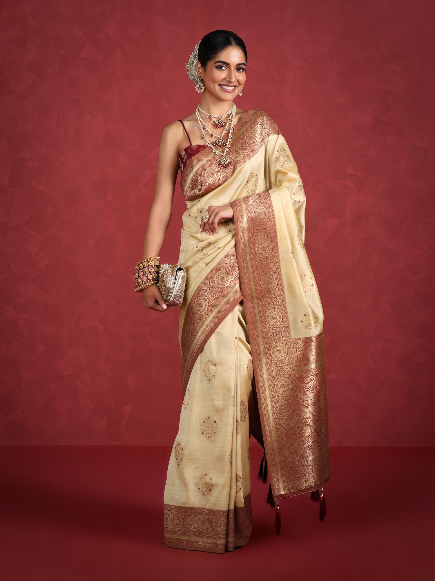 cream art silk woven zari festive saree & unstitched blouse