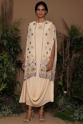 cream draped dress with embroidered jacket