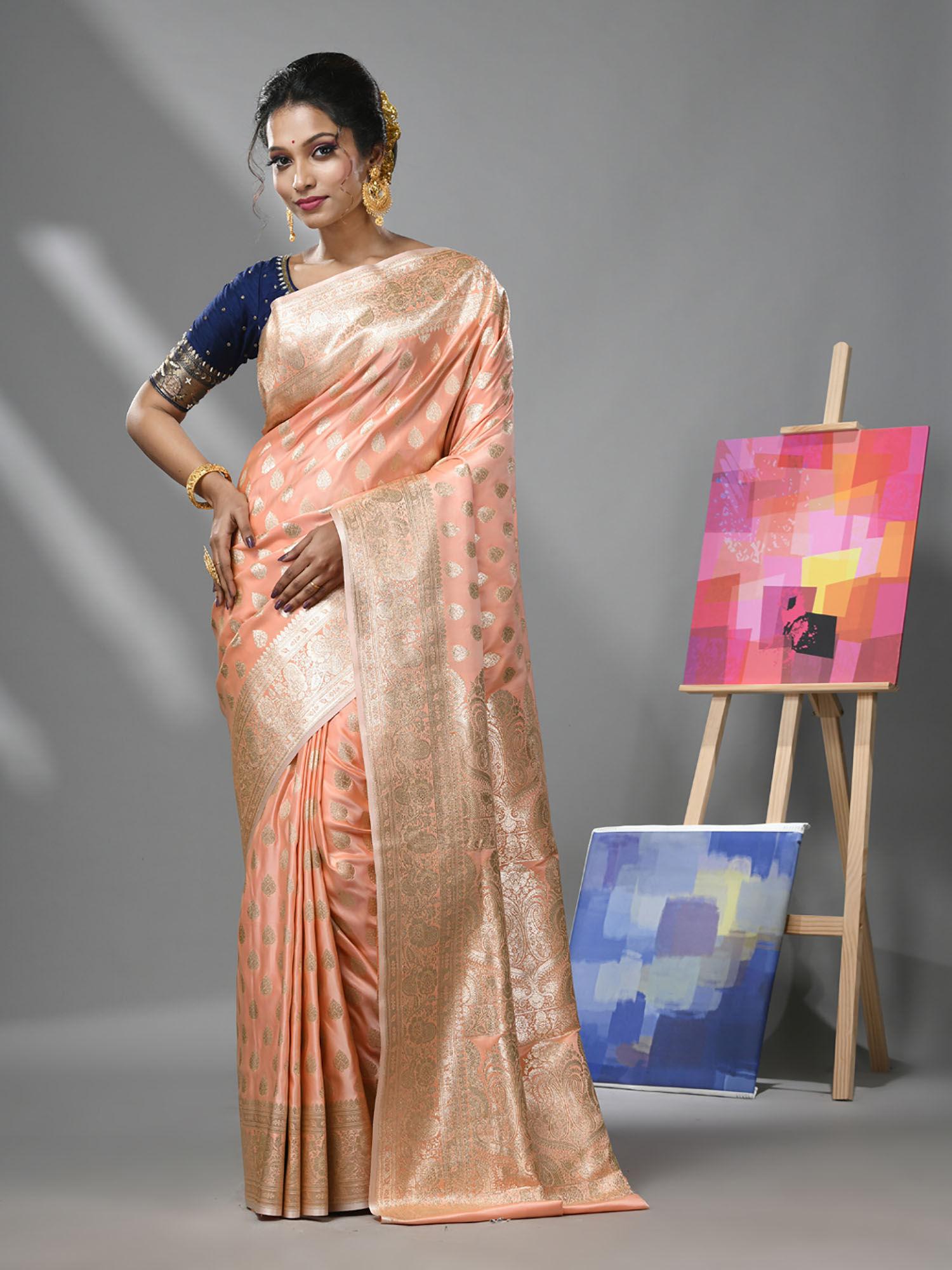 creamy peach katan silk banarasi saree with zari woven designs & unstitched blouse