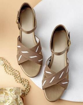 criss-cross sandals with buckle closure