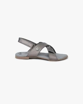 criss-cross strappy sandals with velcro fastening