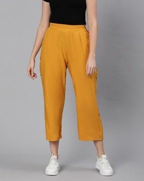 cropped pants with button accents