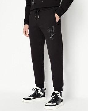 cuffed track pants with gold foil logo print