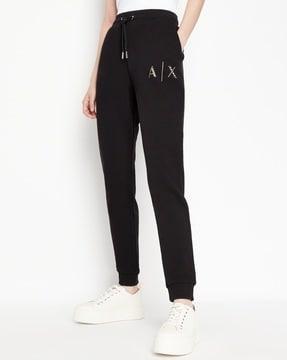 cuffed track pants with elasticated waistband & embellished logo print