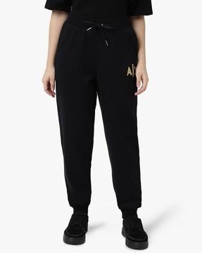 cuffed track pants with golden logo