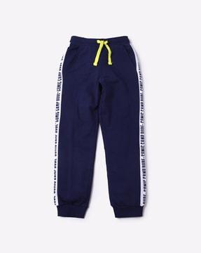 cuffed track pants with typographic side taping