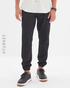 cuffed trousers with slant pockets