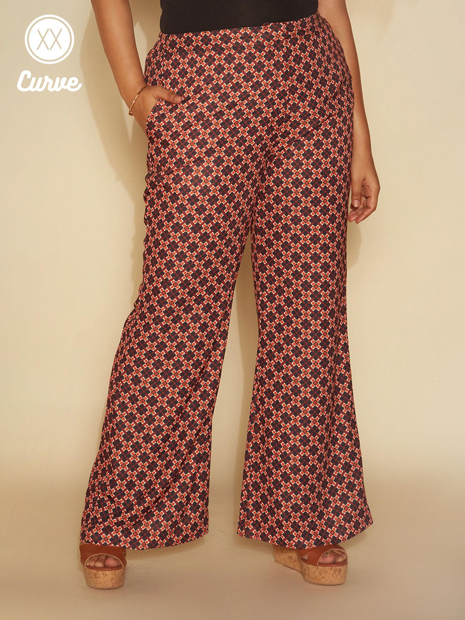 curve rust geometric print flared pants