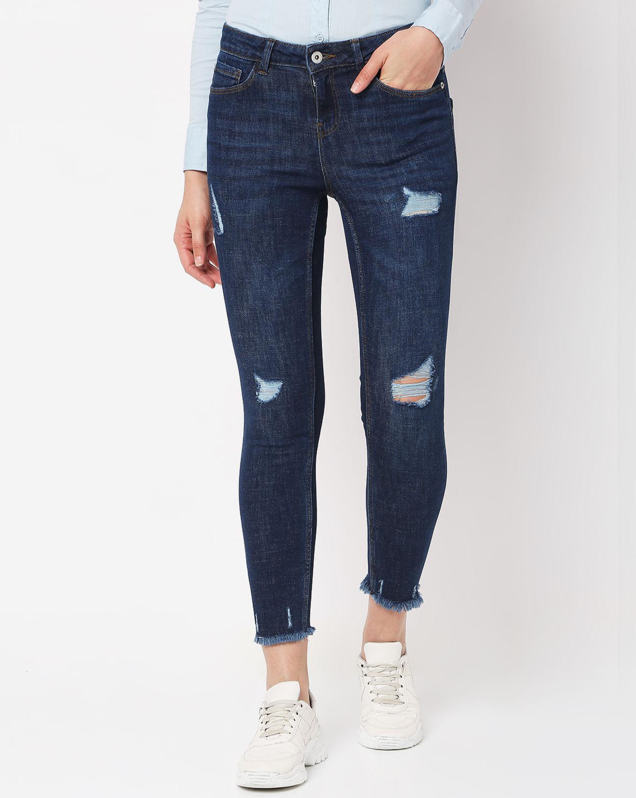 dark blue mid rise distressed skinny jeans