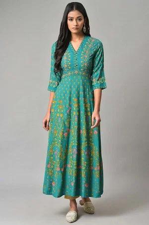 dark green flared dress with floral print and sequins