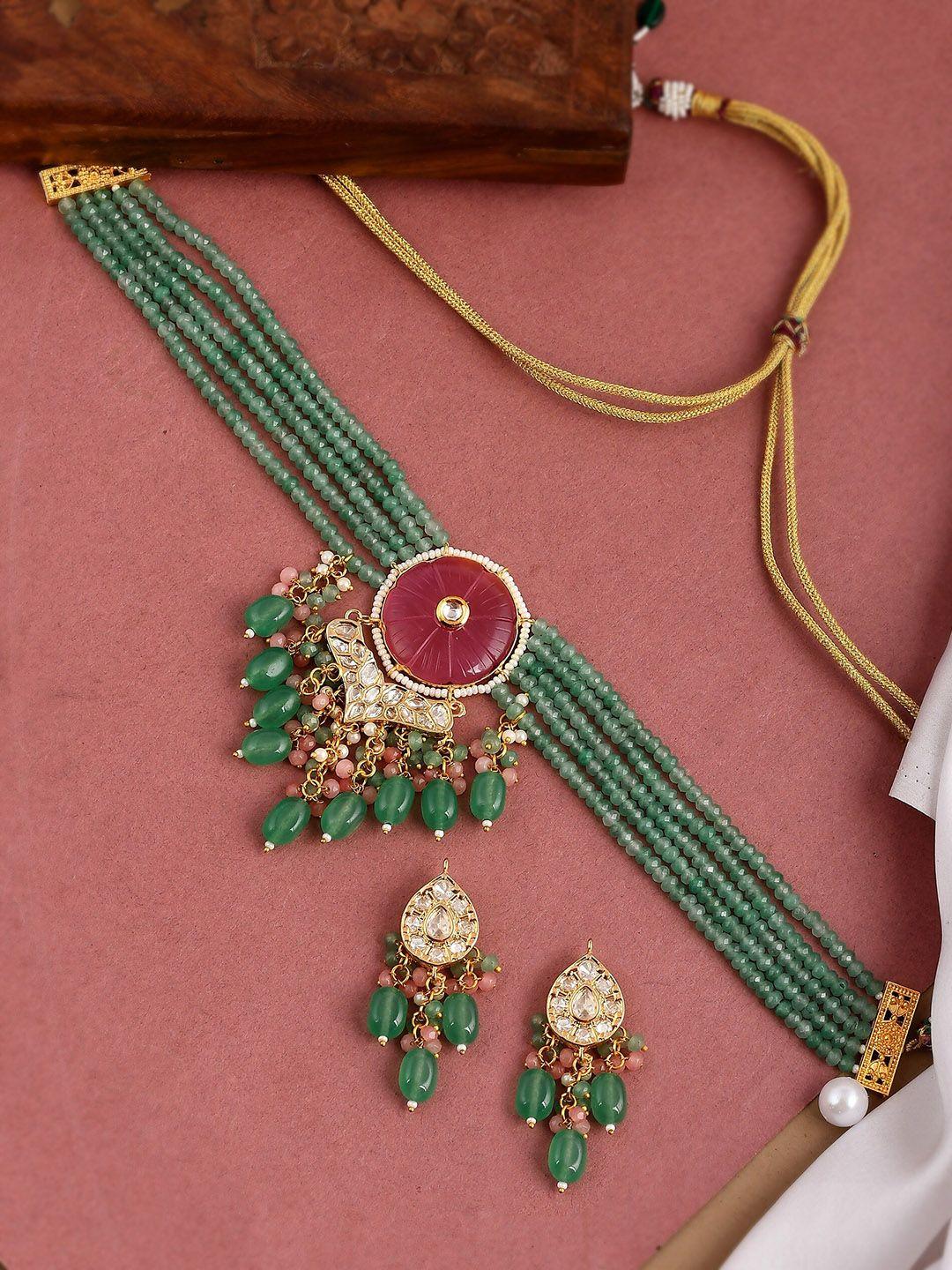 dastoor gold-plated green & maroon kundan studded polki jewellery set