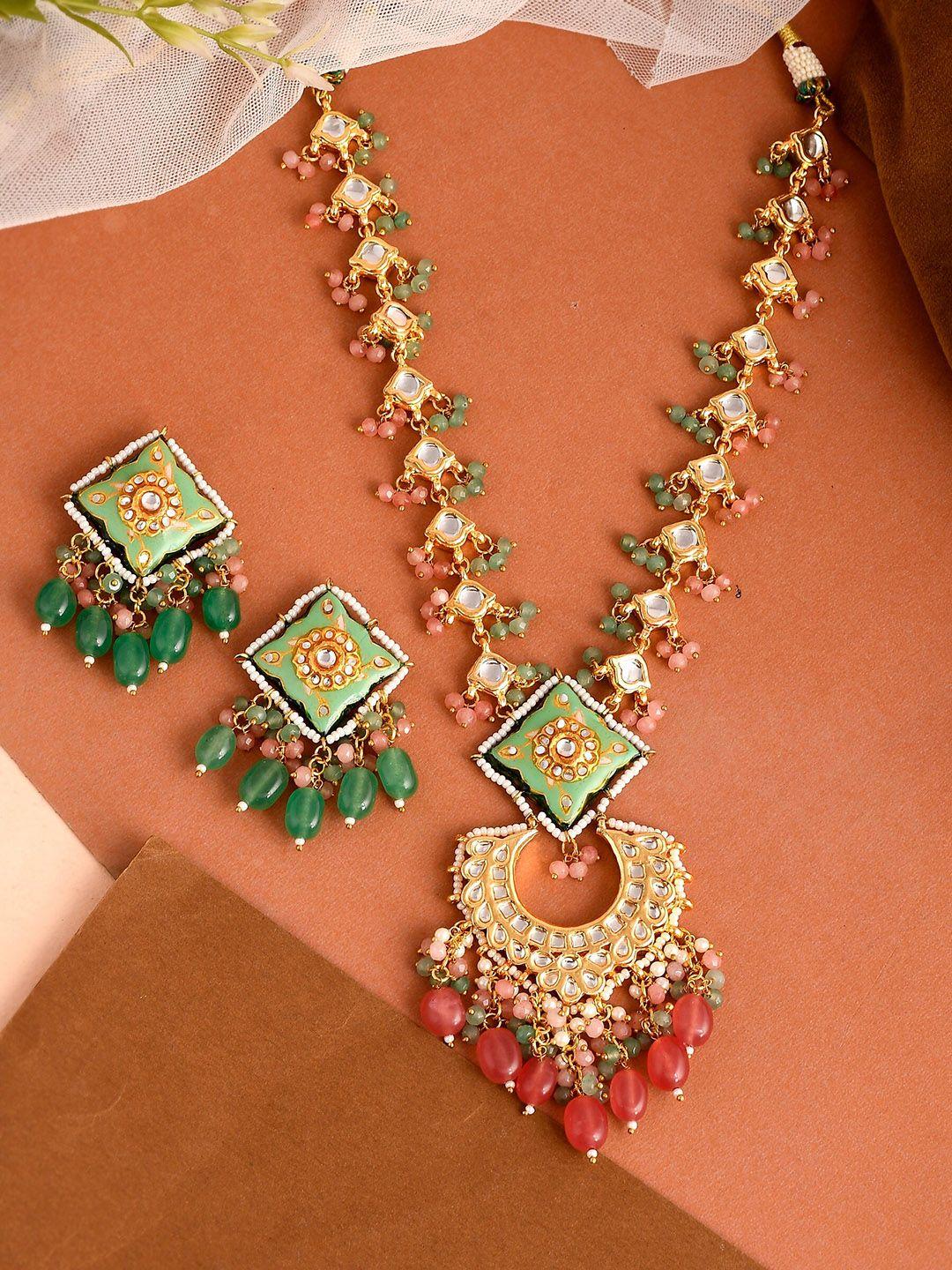 dastoor gold-plated green kundan-studded jewellery set