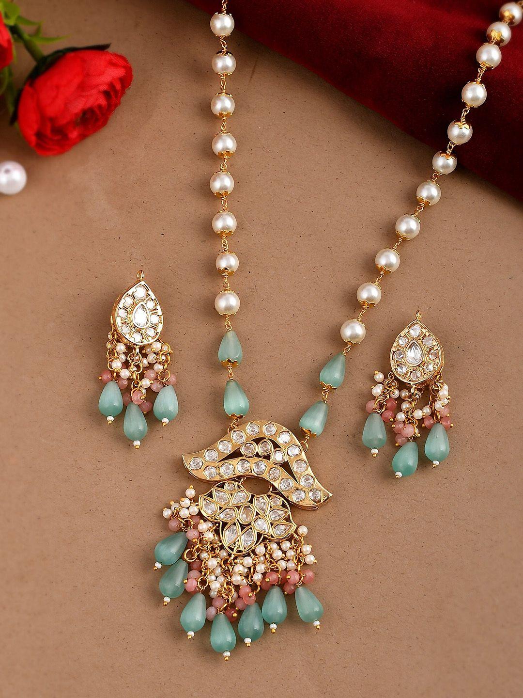 dastoor gold-plated sea green coloured & white kundan studded & beaded jewellery set