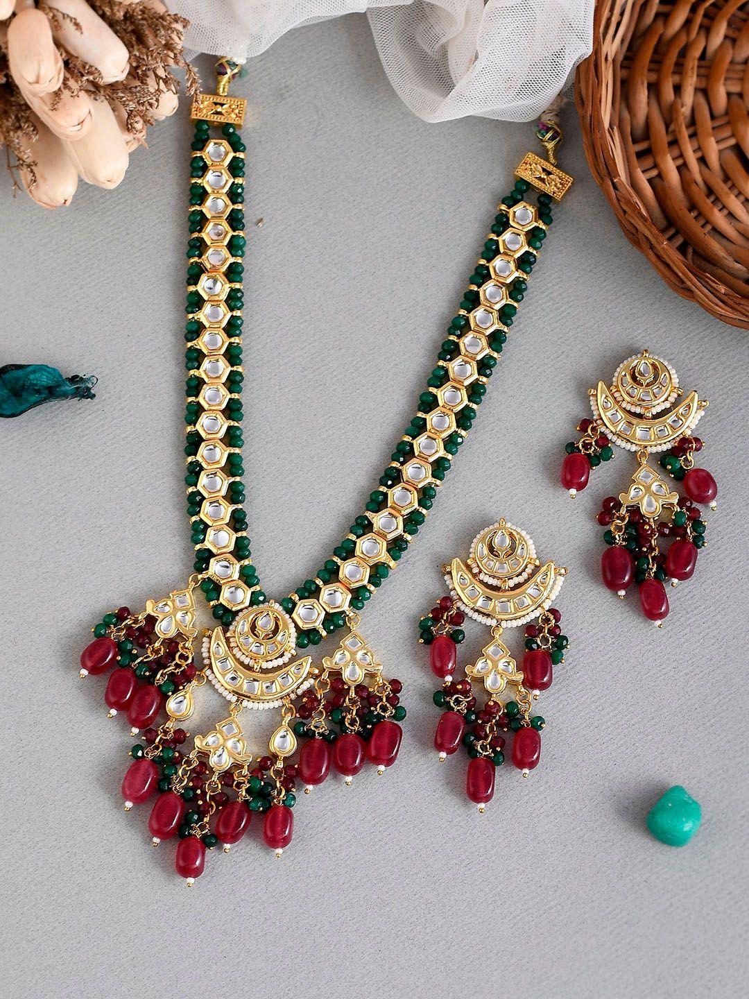 dastoor gold-plated white & green kundan studded & beaded jewellery set