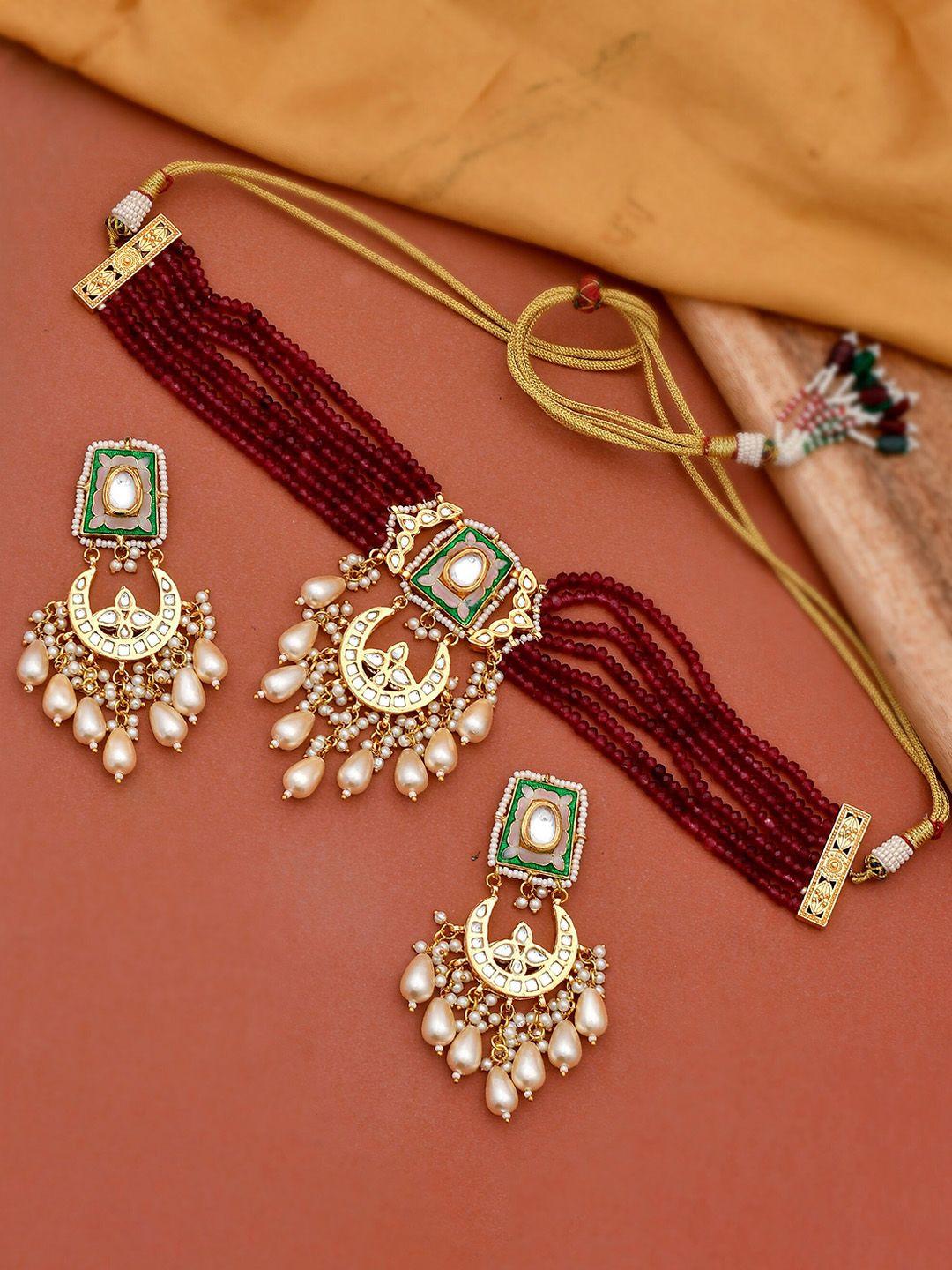 dastoor women maroon & white gold-plated kundan-studded & pearl beaded jewellery set