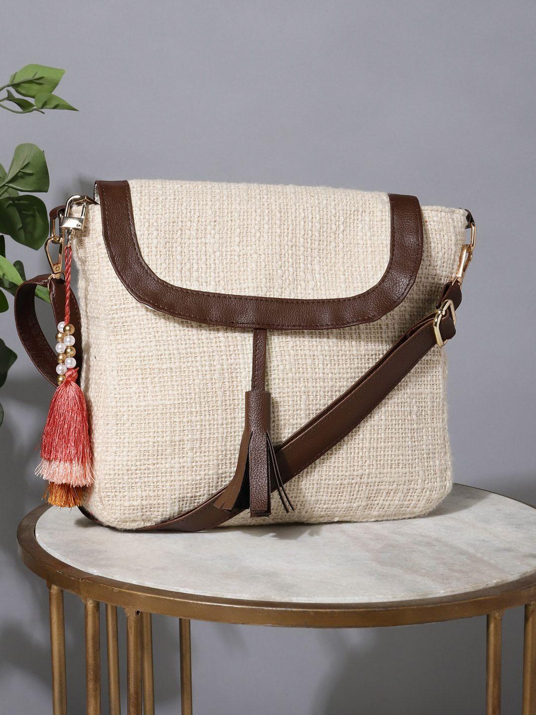 deebaco cream-coloured half moon sling bag with tasselled