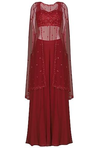 deep red embroidered bustier with sharara pants and cape