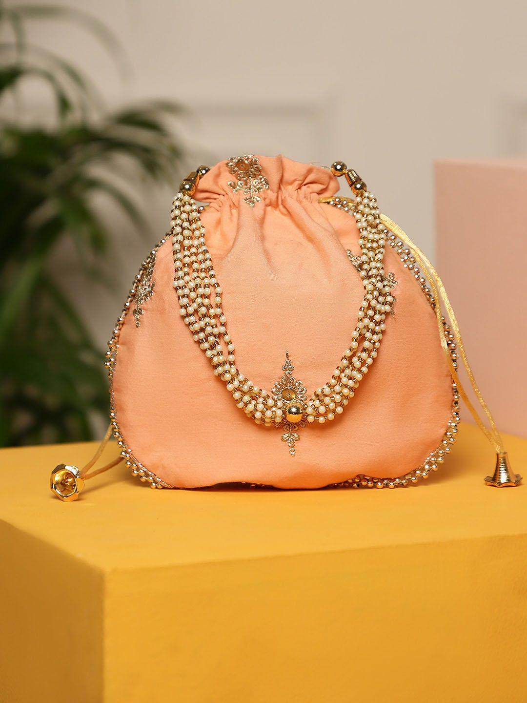 dhrohar peach-coloured ethnic motifs embellished handheld bag