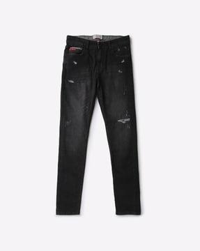 distressed lightly washed slim jeans