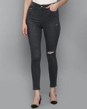 distressed lightly washed skinny fit jeans