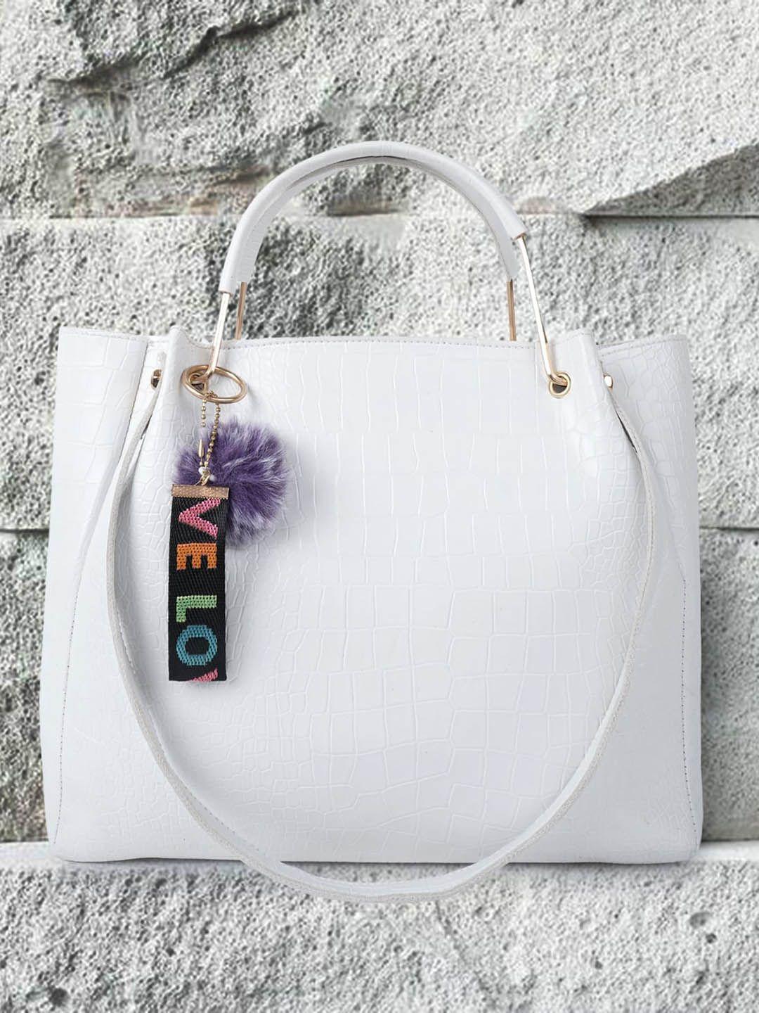 dressberry white textured handheld bag with tasselled