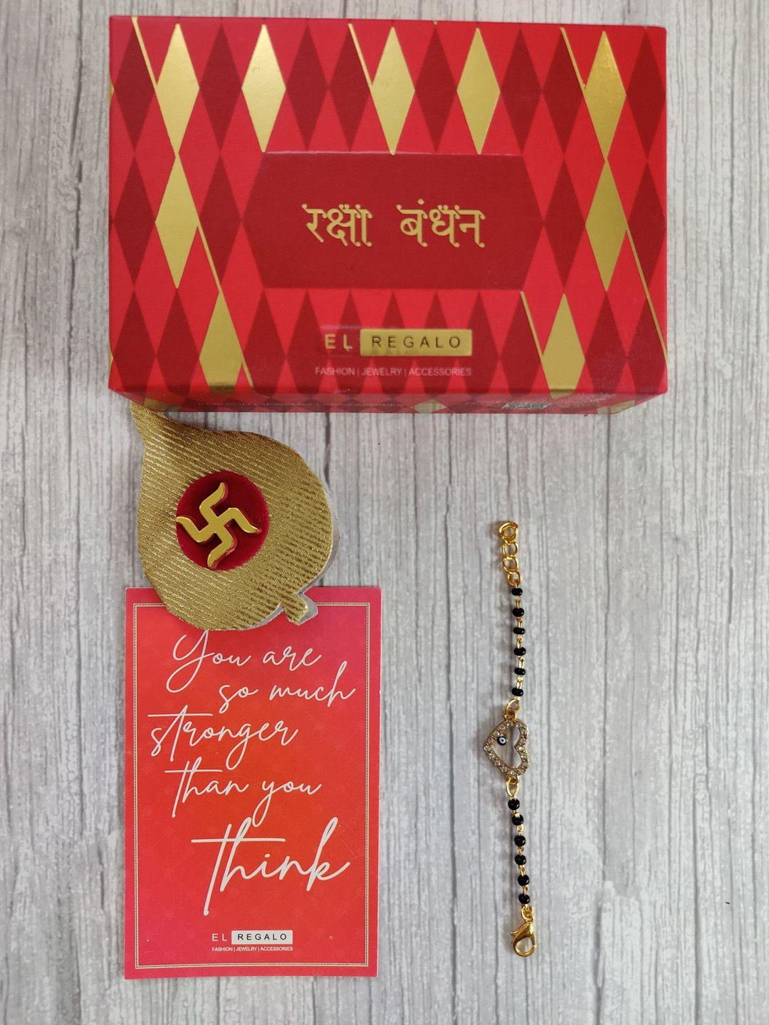 el regalo gold coloured & black evil eye wrap around rakhi with roli chawal & raksha bandhan greeting card