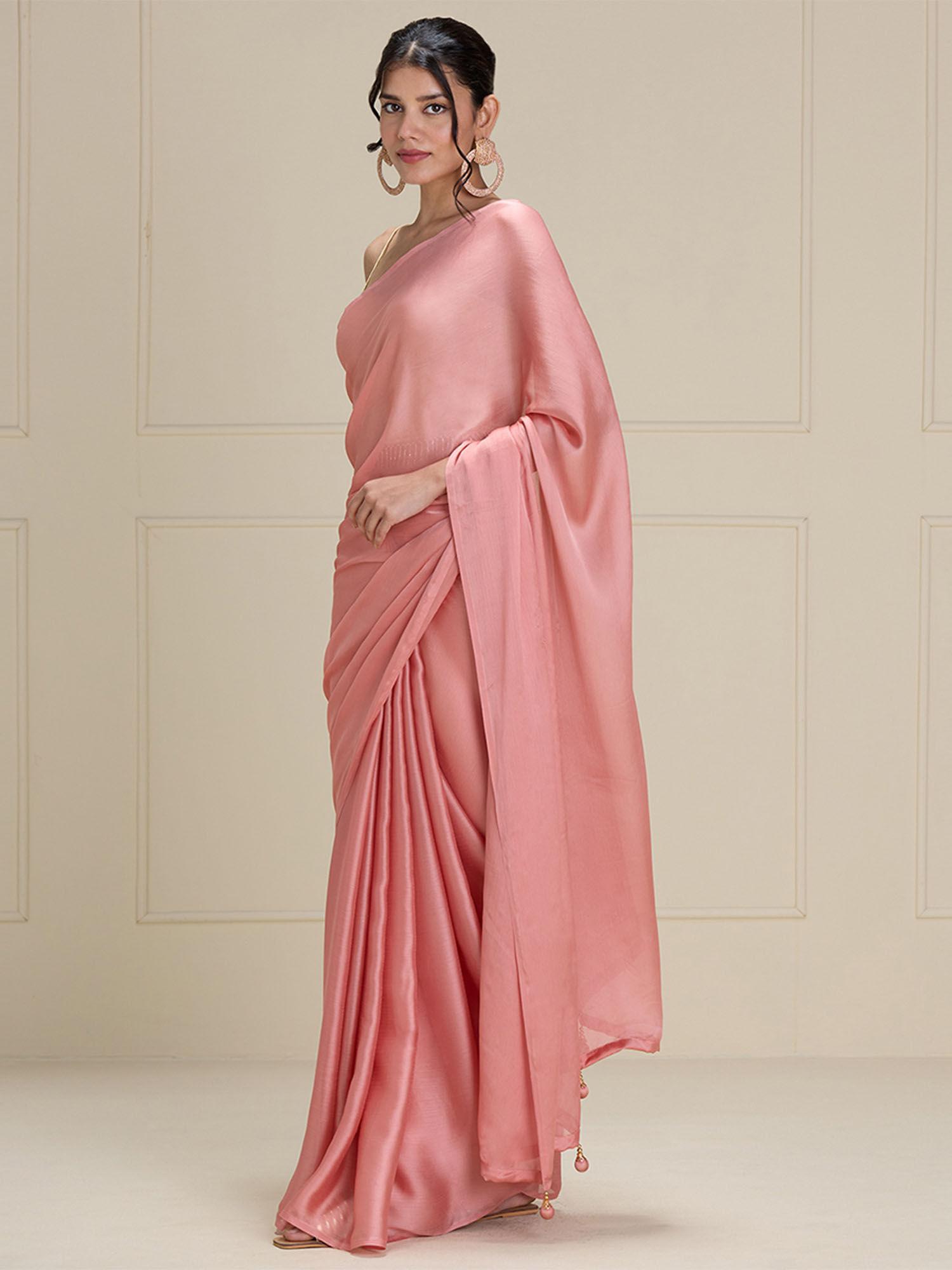 elegant soft and flowy pastel beige solid georgette saree with tassels with unstitched blouse