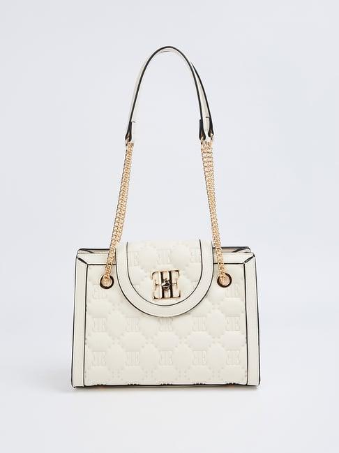 elle cream textured sling handbag
