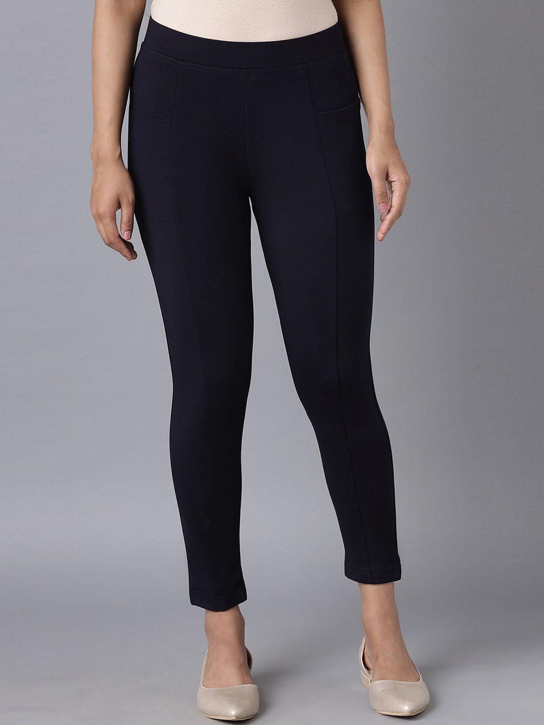 elleven women navy blue solid straight yoga tights