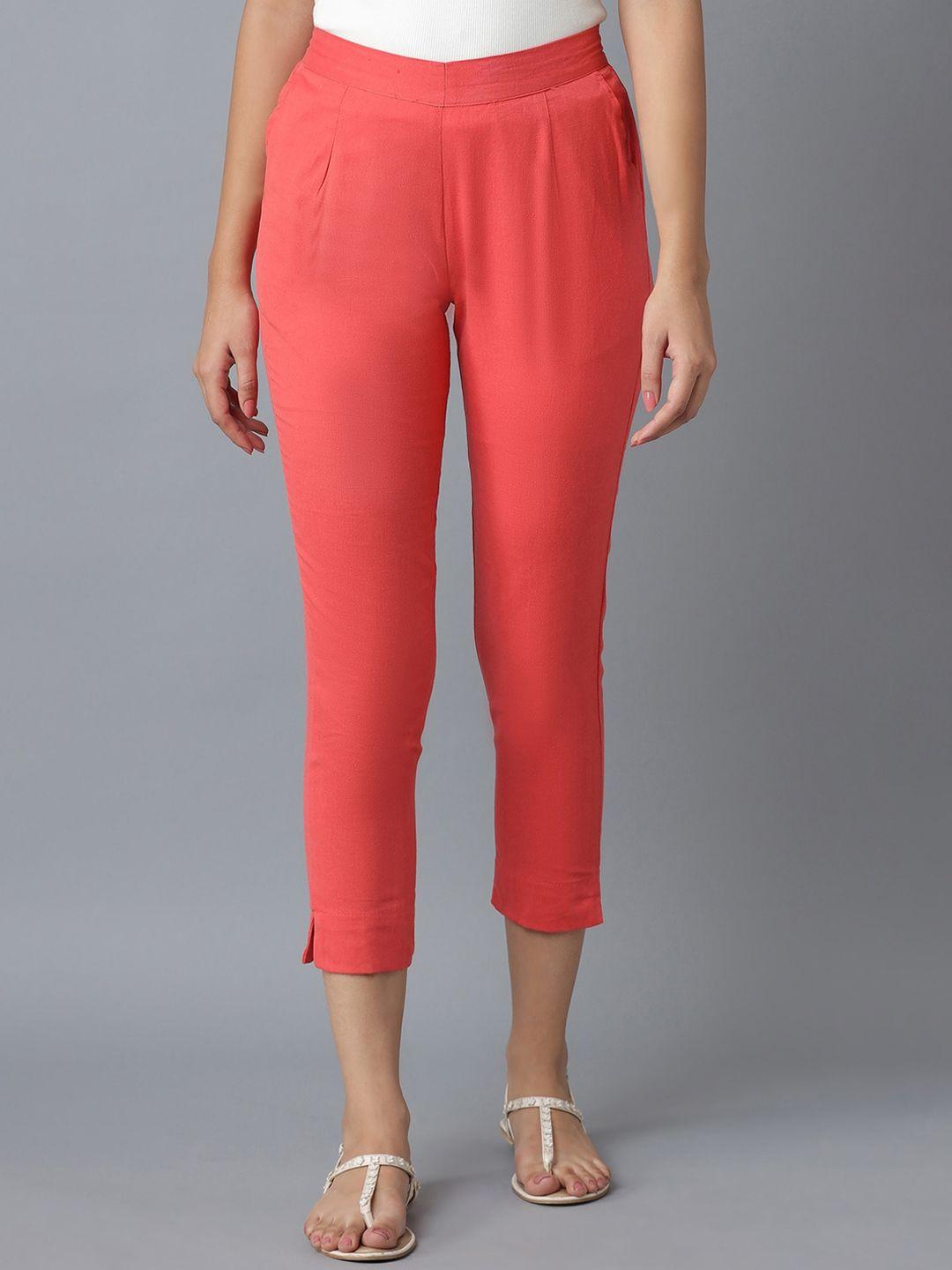 elleven women peach-coloured solid tapered fit pleated trousers