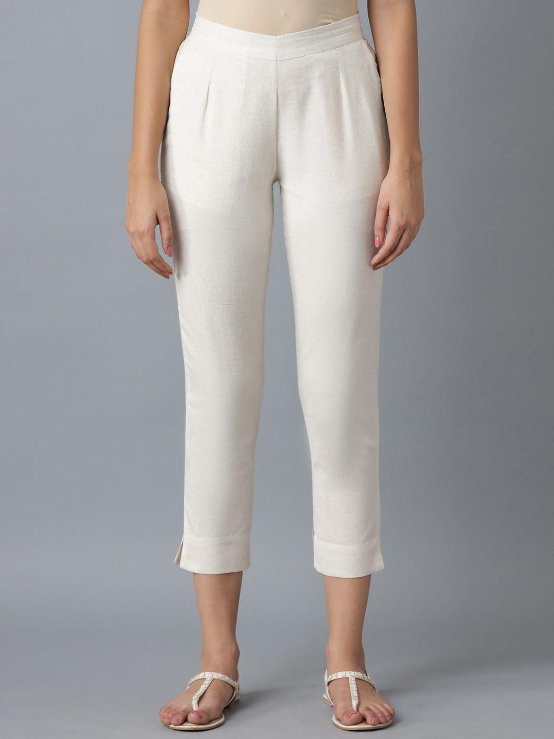 elleven women white solid slim fit pleated trousers