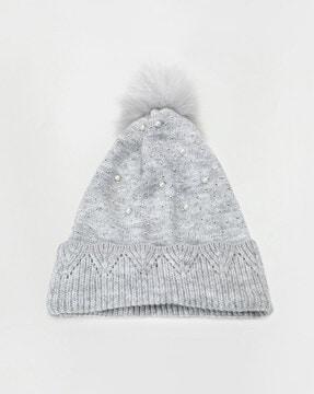 embellished beanie with pom-pom