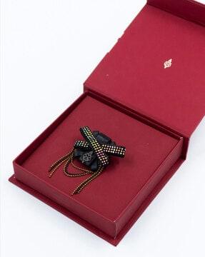 embellished criss-cross crest brooch