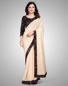 embellished georgette saree with lace border