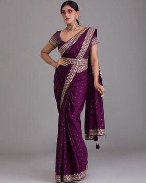 embellished saree with contrast border & tassels