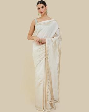 embellished saree with tassels