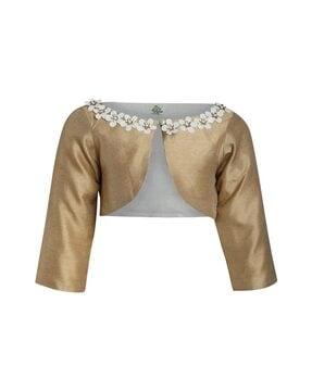 embellished shrug with button-loop closure