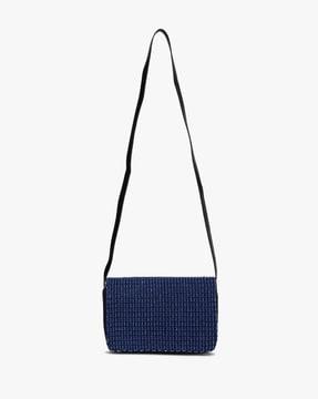 embellished sling bag with flap closure