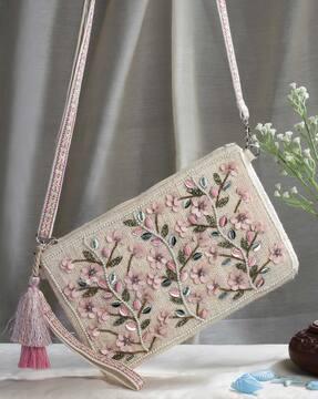 embellished sling bag with zip-closure